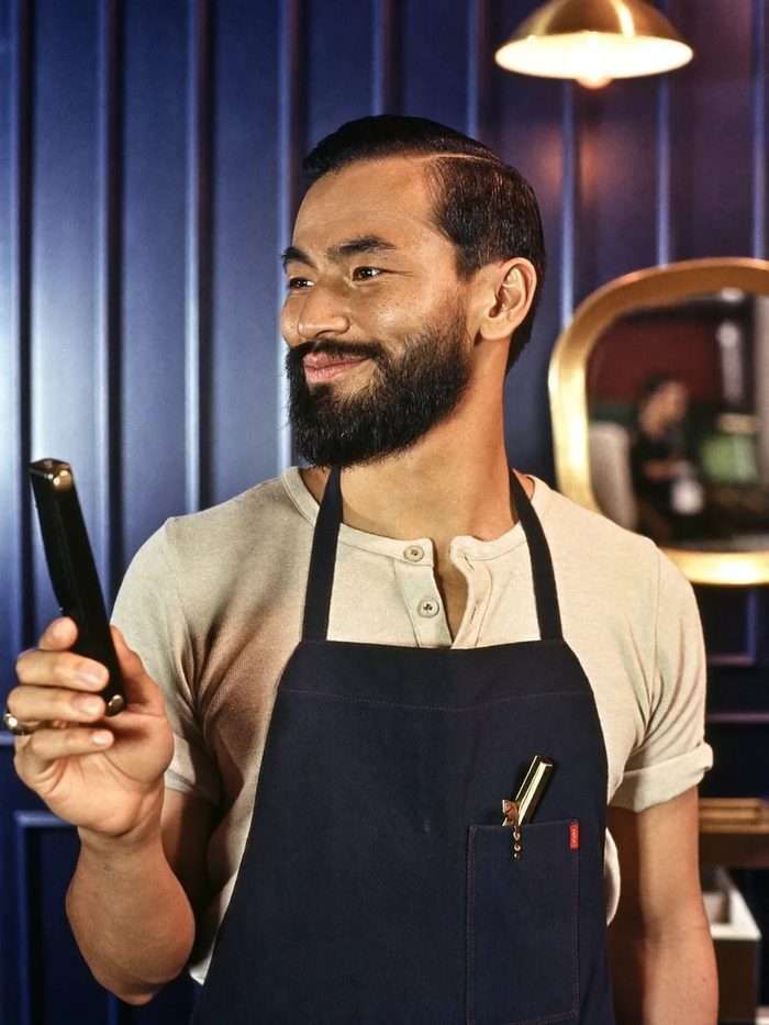 Portrait of Paolo Santos, beard specialist at The Barber Parlor